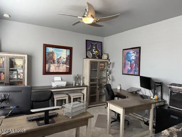 a view of a workspace with furniture