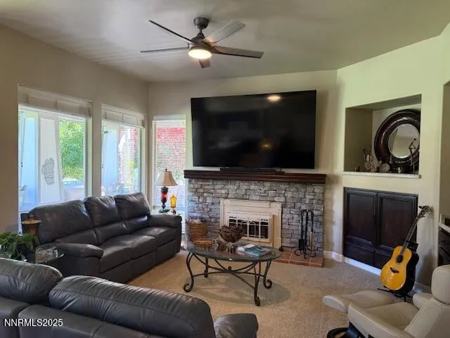a living room with furniture and a flat screen tv