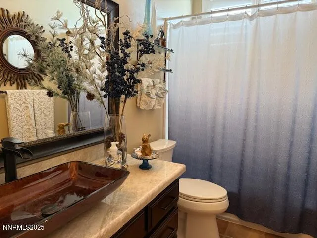 a bathroom with a sink toilet and vanity