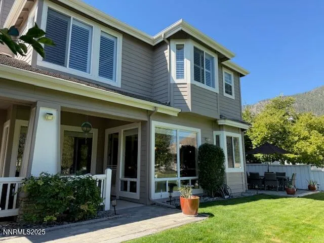 a front view of house with outdoor seating
