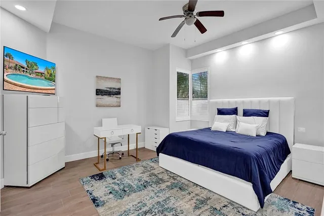 a bedroom with a bed and a table