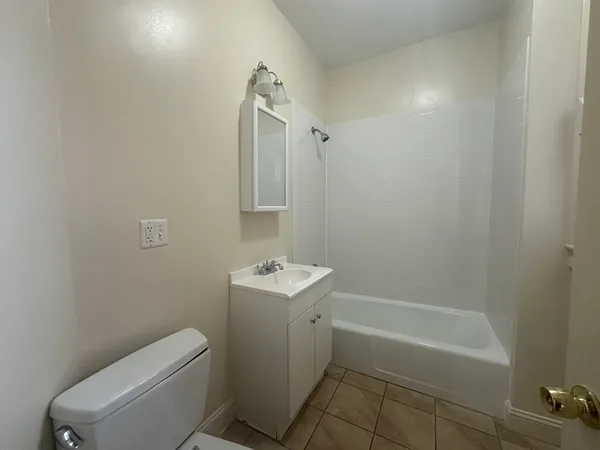 a bathroom with a toilet sink and bathtub