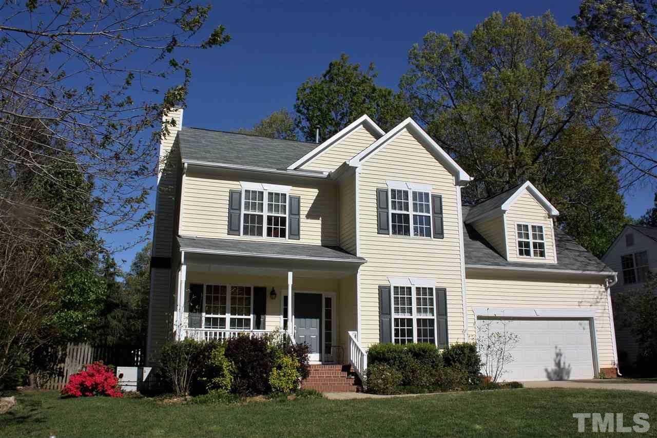 908 Cedar Downs Drive Raleigh, NC 27607 - Photo 1 of 25 a front view of a house with a yard