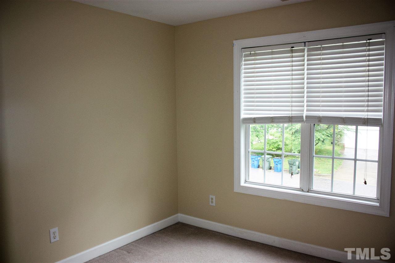908 Cedar Downs Drive Raleigh, NC 27607 - Photo 14 of 25 an empty room with a window