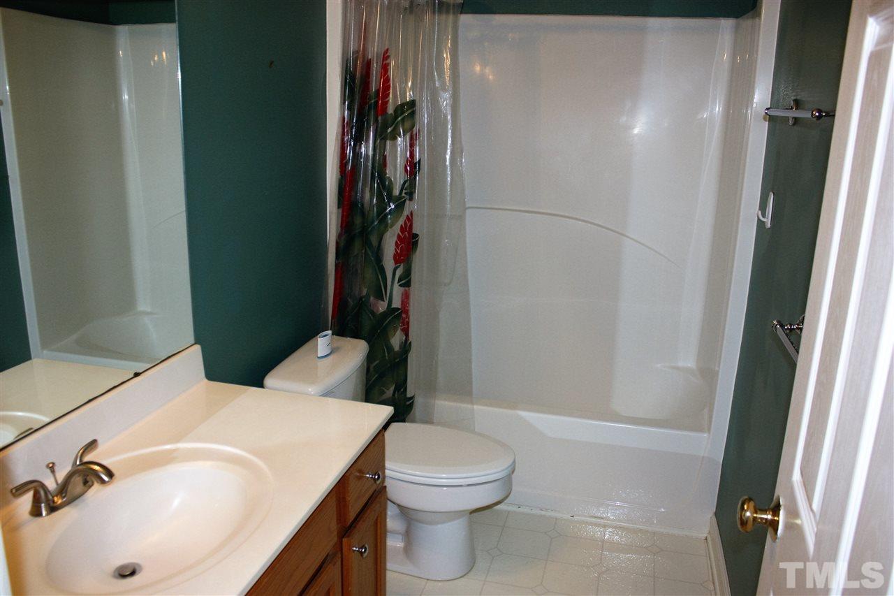 908 Cedar Downs Drive Raleigh, NC 27607 - Photo 16 of 25 a bathroom with a sink and toilet