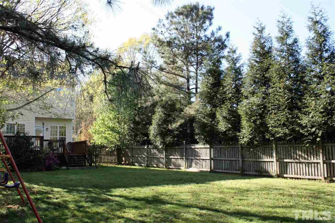908 Cedar Downs Drive Raleigh, NC 27607 - Photo 22 of 25 a view of a house with a yard porch and sitting area