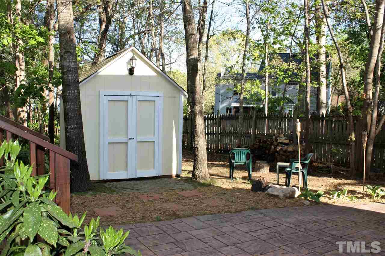 908 Cedar Downs Drive Raleigh, NC 27607 - Photo 23 of 25 a view of a house with a yard and tree s