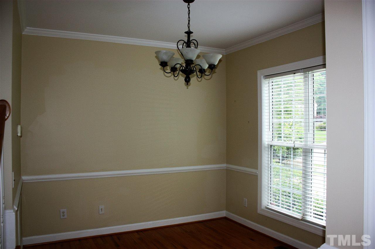 908 Cedar Downs Drive Raleigh, NC 27607 - Photo 5 of 25 a view of a room with a window and wooden floor
