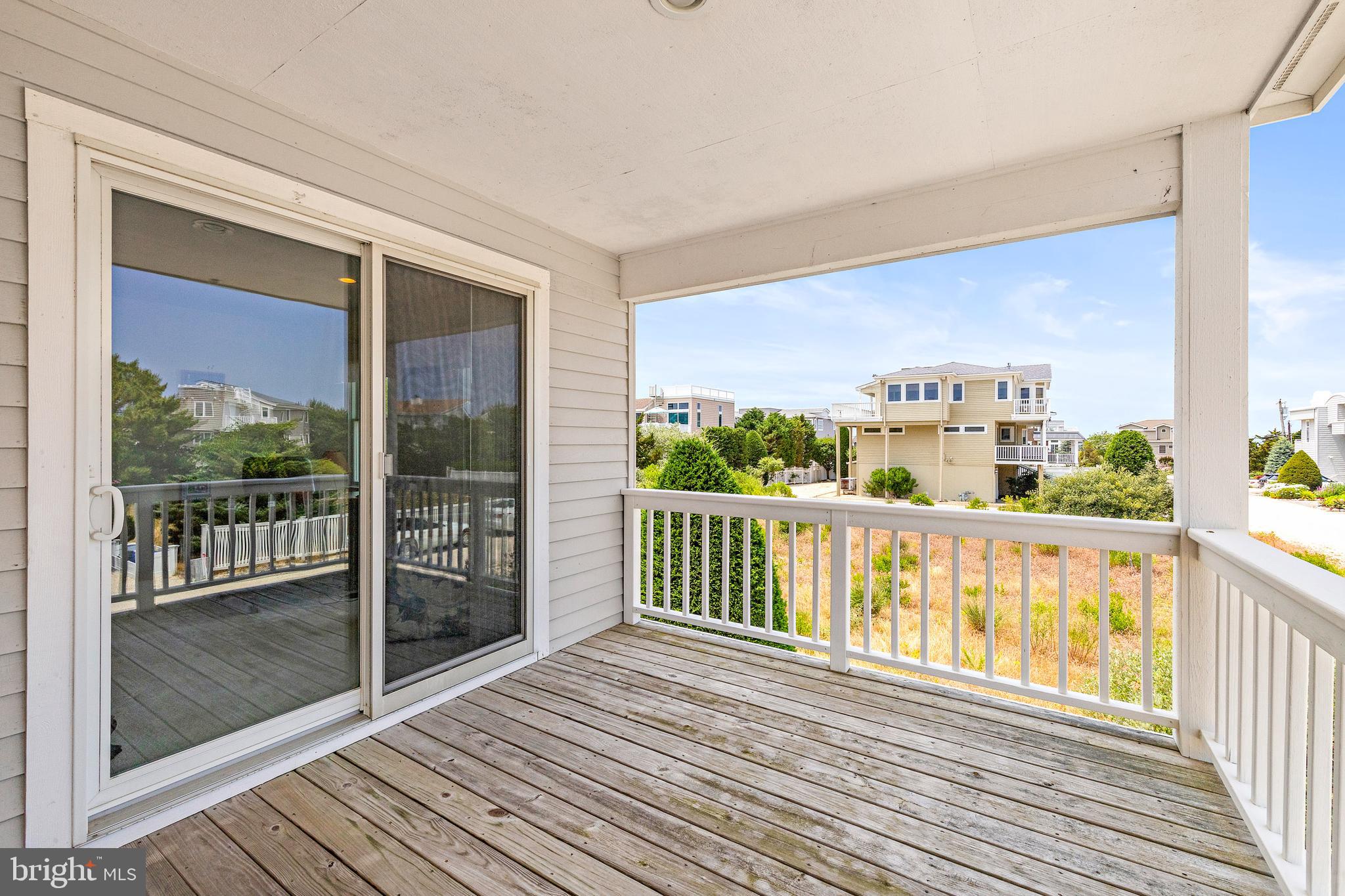 57 Sunset Boulevard Long Beach Township, NJ 08006 - Photo 42 of 65 Covered deck with sliding doors