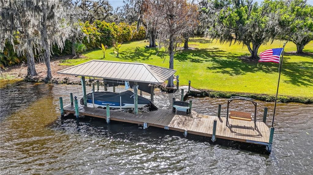 1964 Rialto Way Alva, FL 33920 - Photo 49 of 50 a view of a swimming pool with a patio