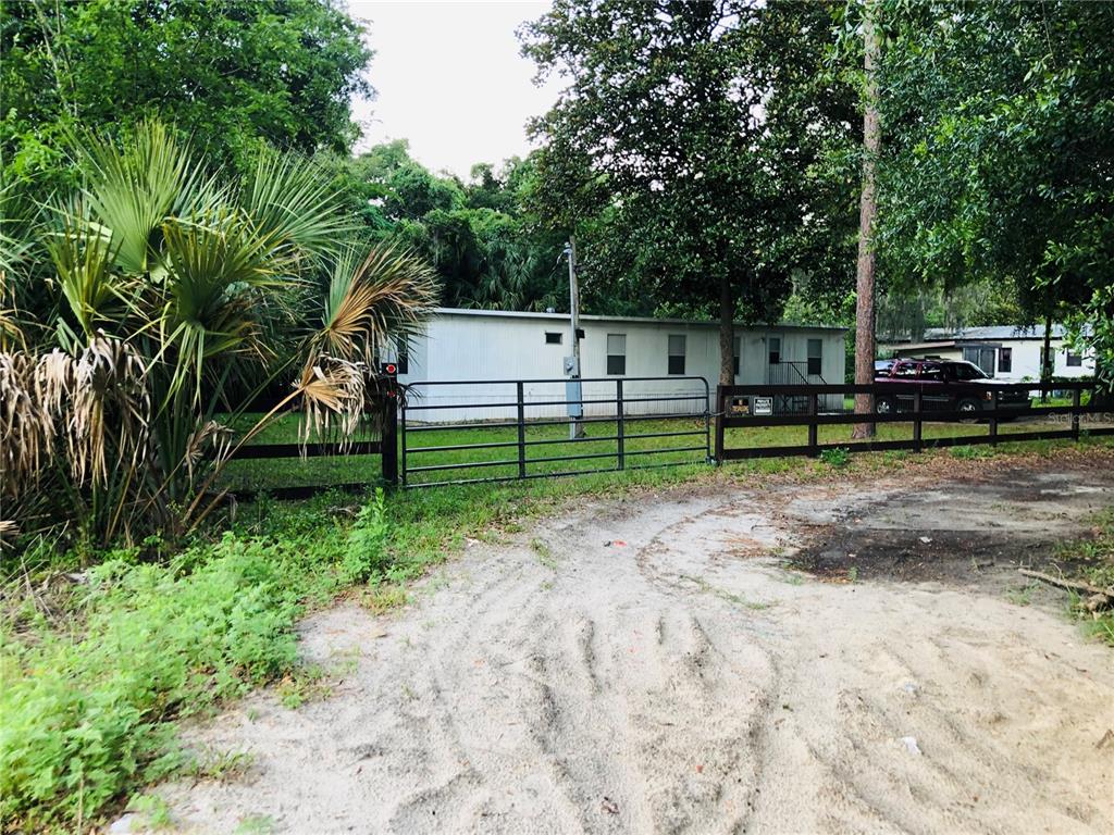 3545 Southwest 90th Street Ocala, FL 34476 - Photo 1 of 24 a view of park with bench and trees