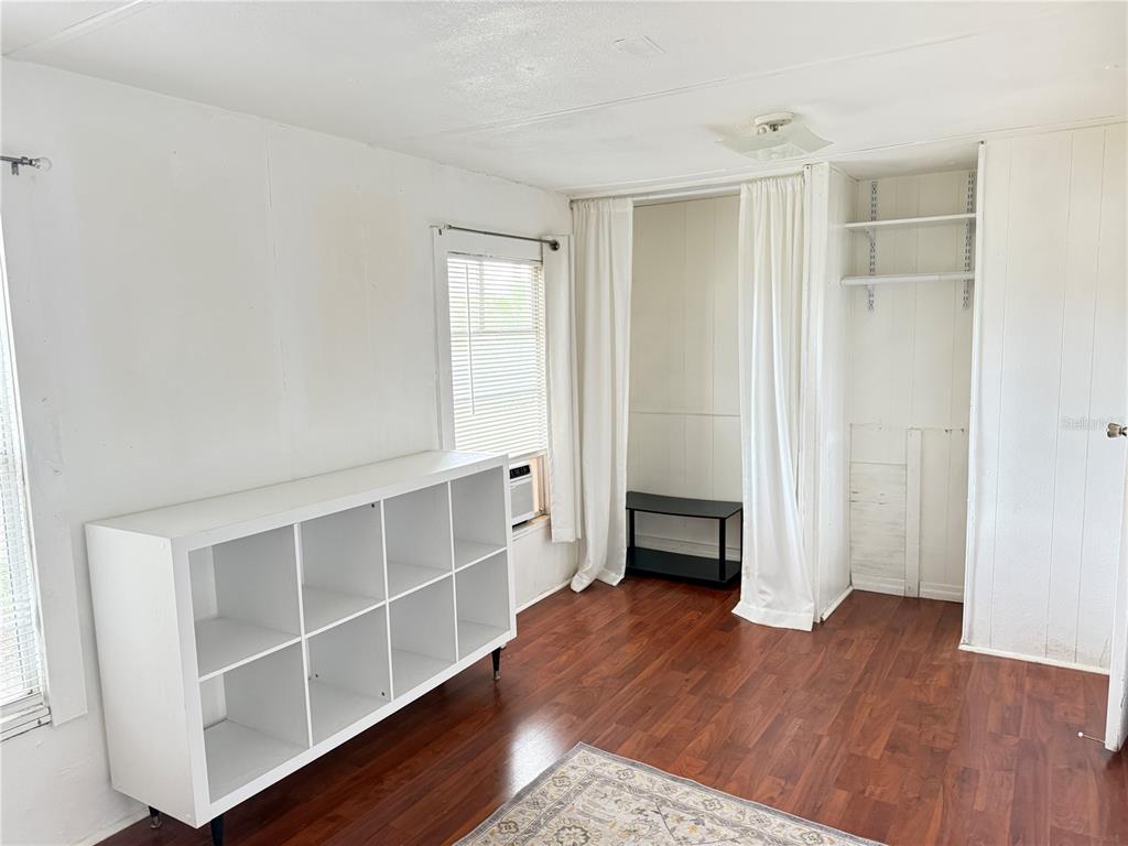 3545 Southwest 90th Street Ocala, FL 34476 - Photo 11 of 24 a view of an empty room with wooden floor and closet