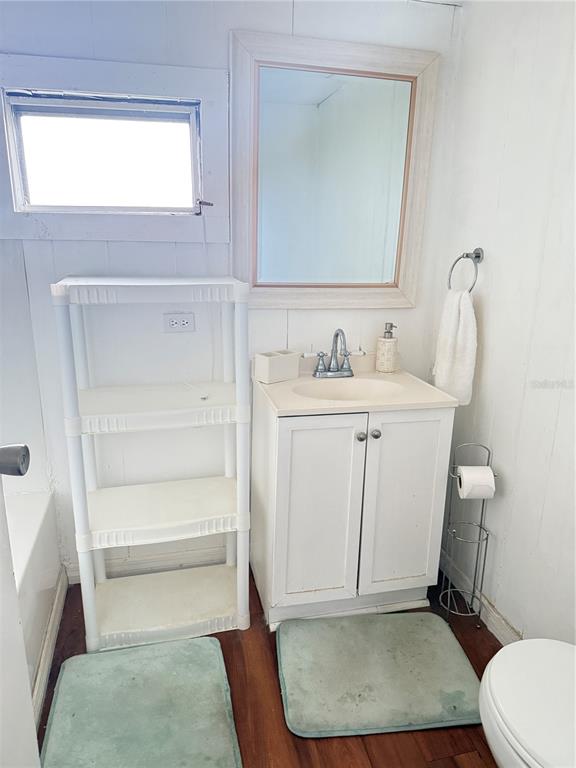 3545 Southwest 90th Street Ocala, FL 34476 - Photo 14 of 24 a bathroom with a sink a toilet and a mirror