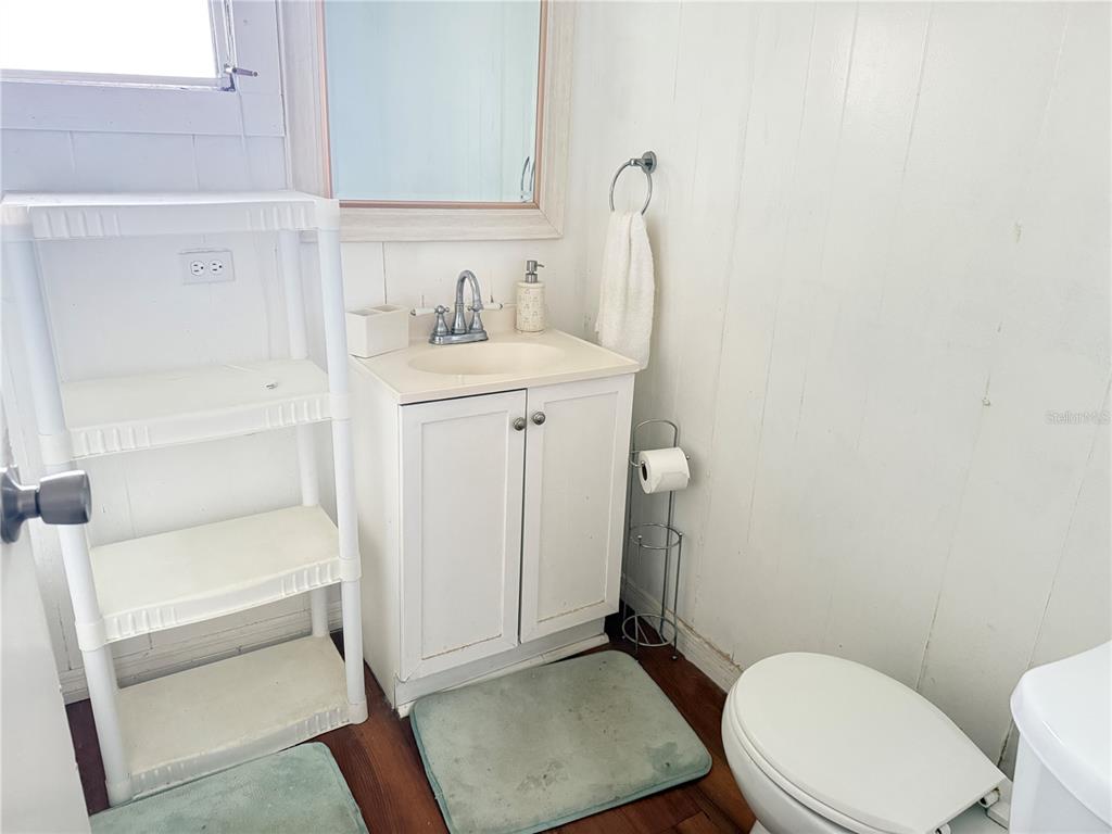 3545 Southwest 90th Street Ocala, FL 34476 - Photo 15 of 24 a bathroom with a sink a toilet and shower