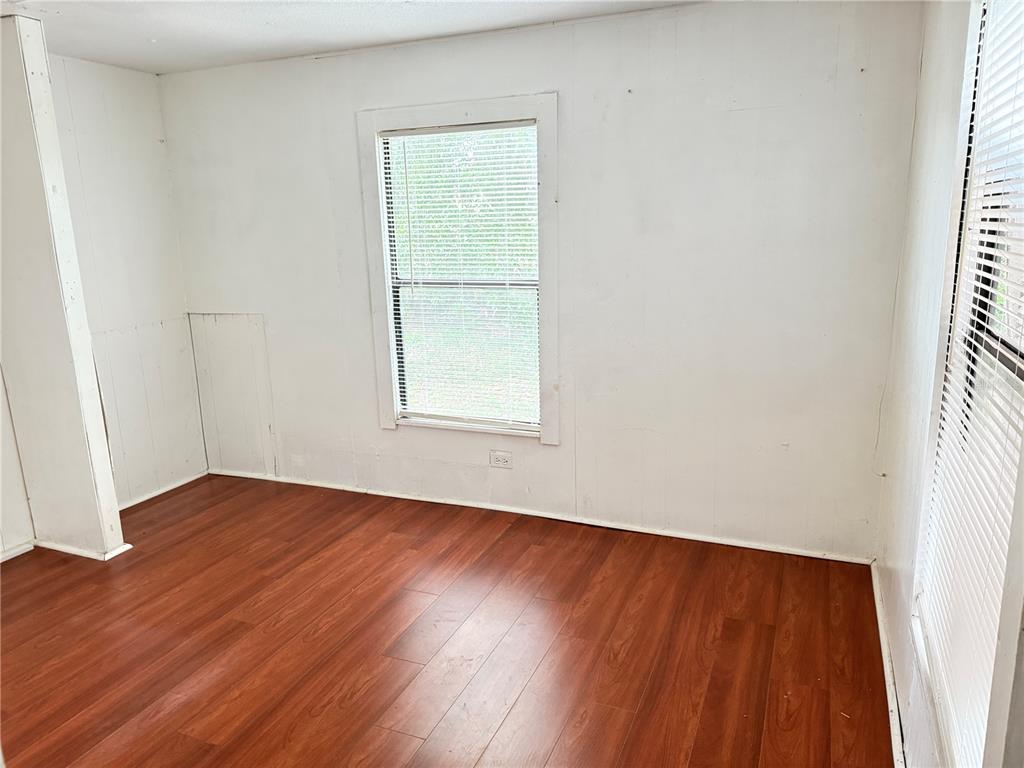 3545 Southwest 90th Street Ocala, FL 34476 - Photo 17 of 24 an empty room with wooden floor and windows
