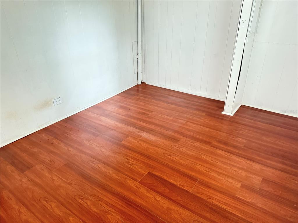 3545 Southwest 90th Street Ocala, FL 34476 - Photo 18 of 24 an empty room with wooden floor