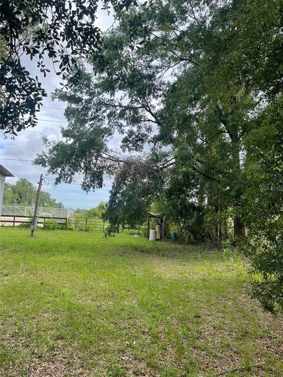 3545 Southwest 90th Street Ocala, FL 34476 - Photo 20 of 24 a view of outdoor space with deck and yard