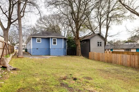 a house with a large tree in front of it