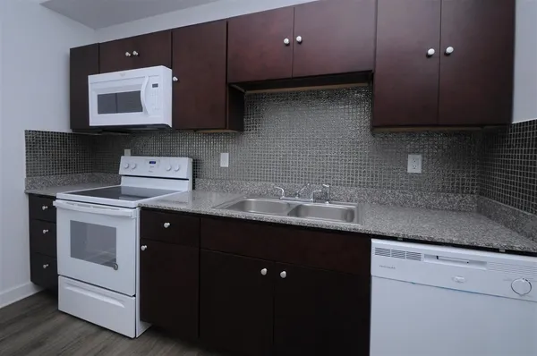 a kitchen with a sink and a stove
