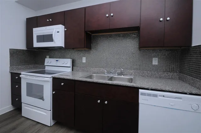 a kitchen with a sink and a stove