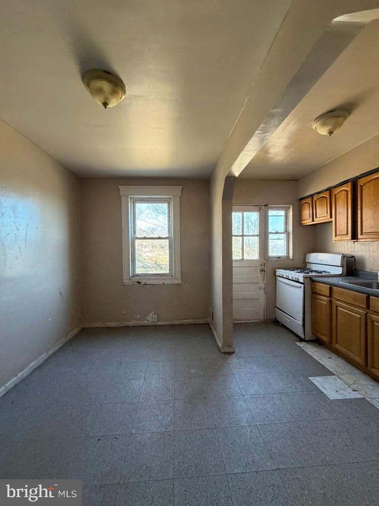 4519 Pall Mall Road Baltimore, MD 21215 - Photo 7 of 19 a view of an empty room with a kitchen