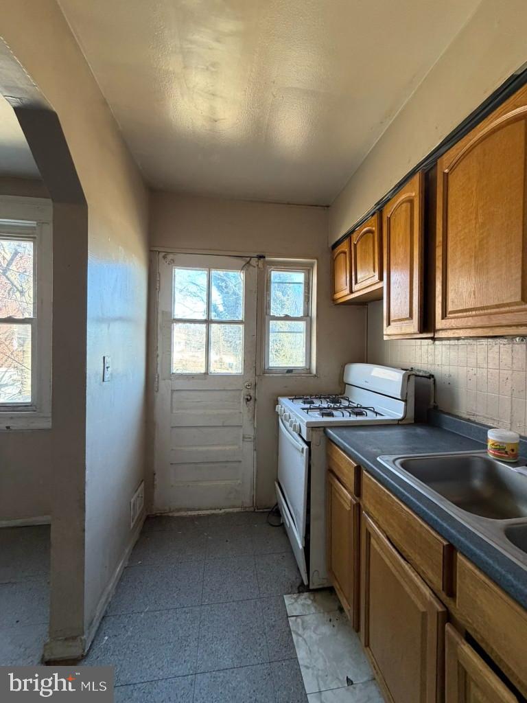 4519 Pall Mall Road Baltimore, MD 21215 - Photo 9 of 19 a kitchen that has a sink and a stove