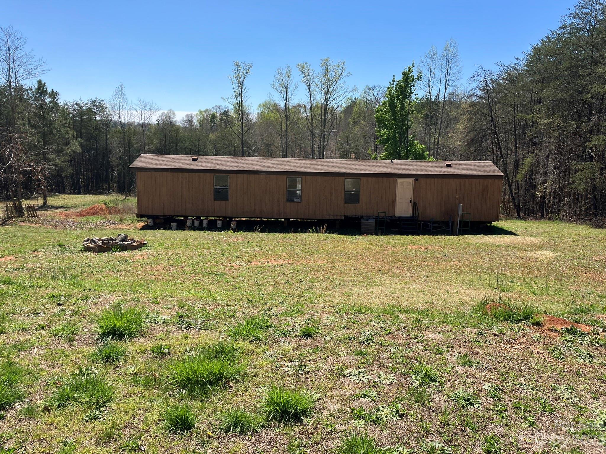 248 Old Ross Road, Unit 2 Spindale, NC 28160 - Photo 1 of 16 a backyard of house with green space