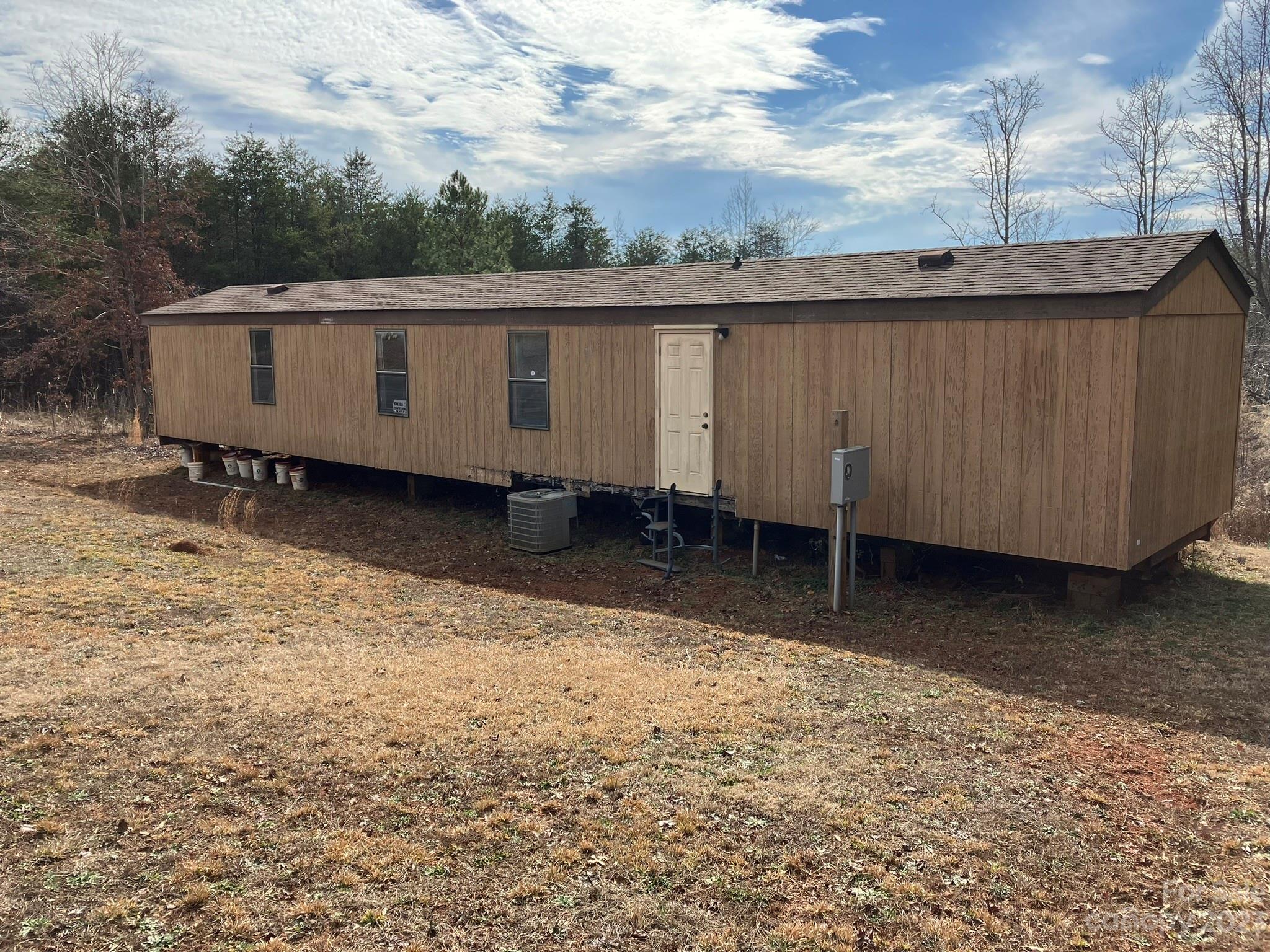 248 Old Ross Road, Unit 2 Spindale, NC 28160 - Photo 3 of 16 a view of a backyard with green space