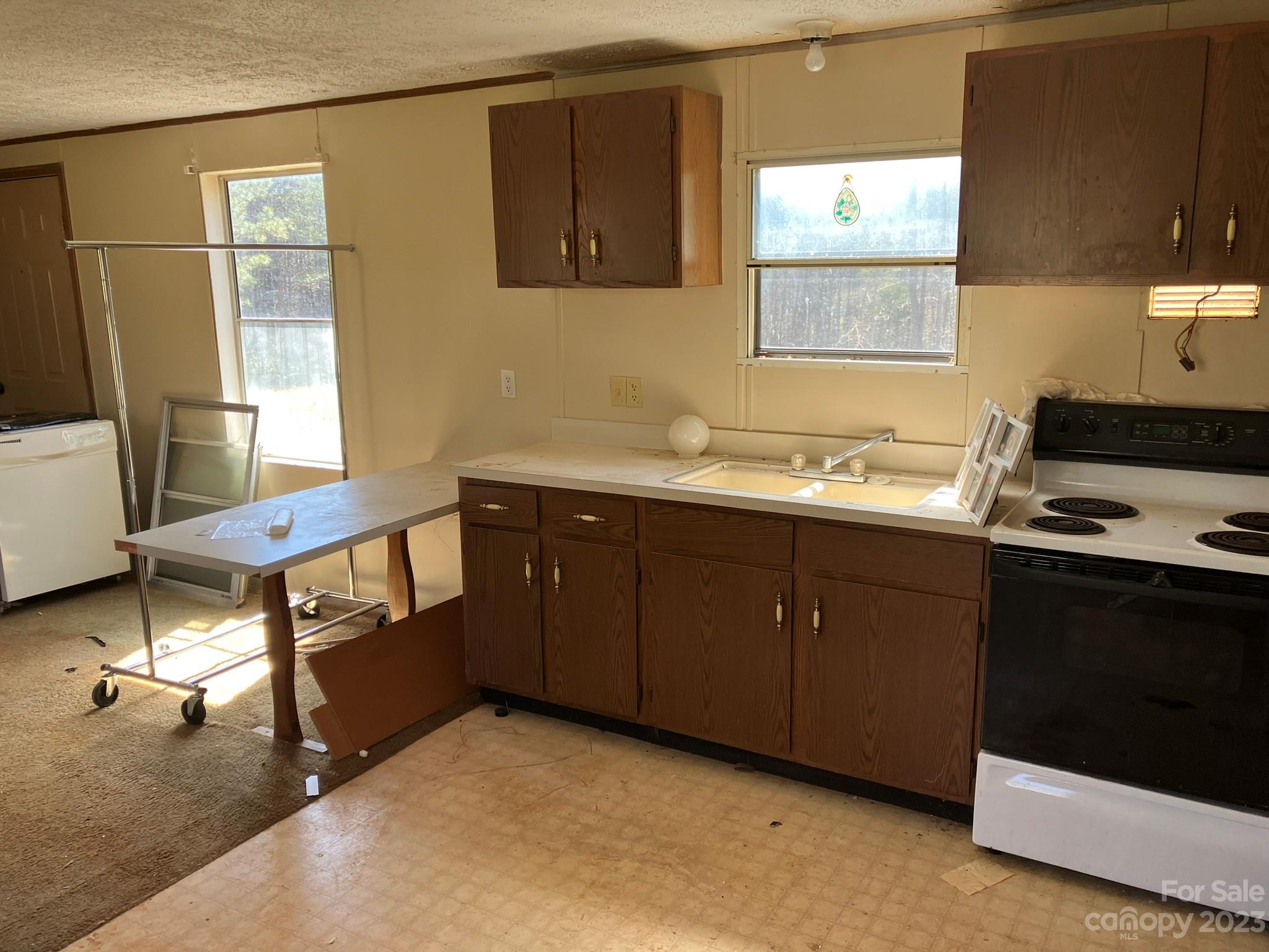 248 Old Ross Road, Unit 2 Spindale, NC 28160 - Photo 6 of 16 a kitchen with a sink cabinets and window