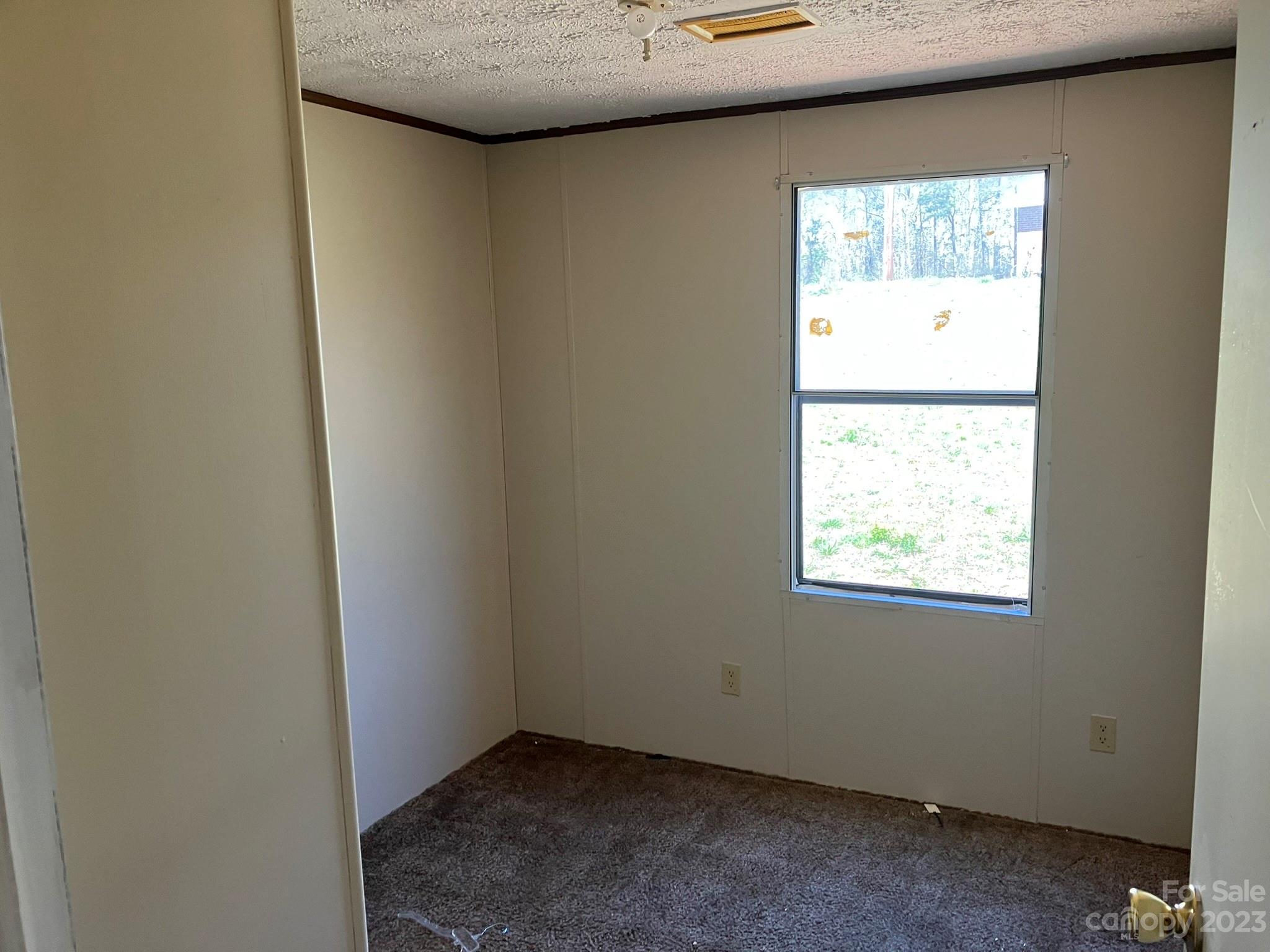 248 Old Ross Road, Unit 2 Spindale, NC 28160 - Photo 8 of 16 a view of an empty room and window