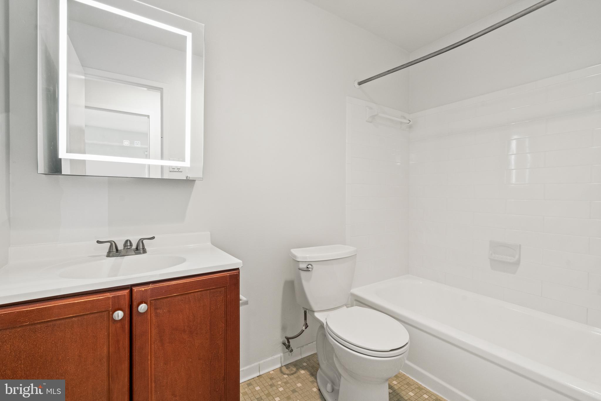 6151 Edsall Road, Unit K Alexandria, VA 22304 - Photo 15 of 27 a bathroom with a sink a toilet and a bathtub