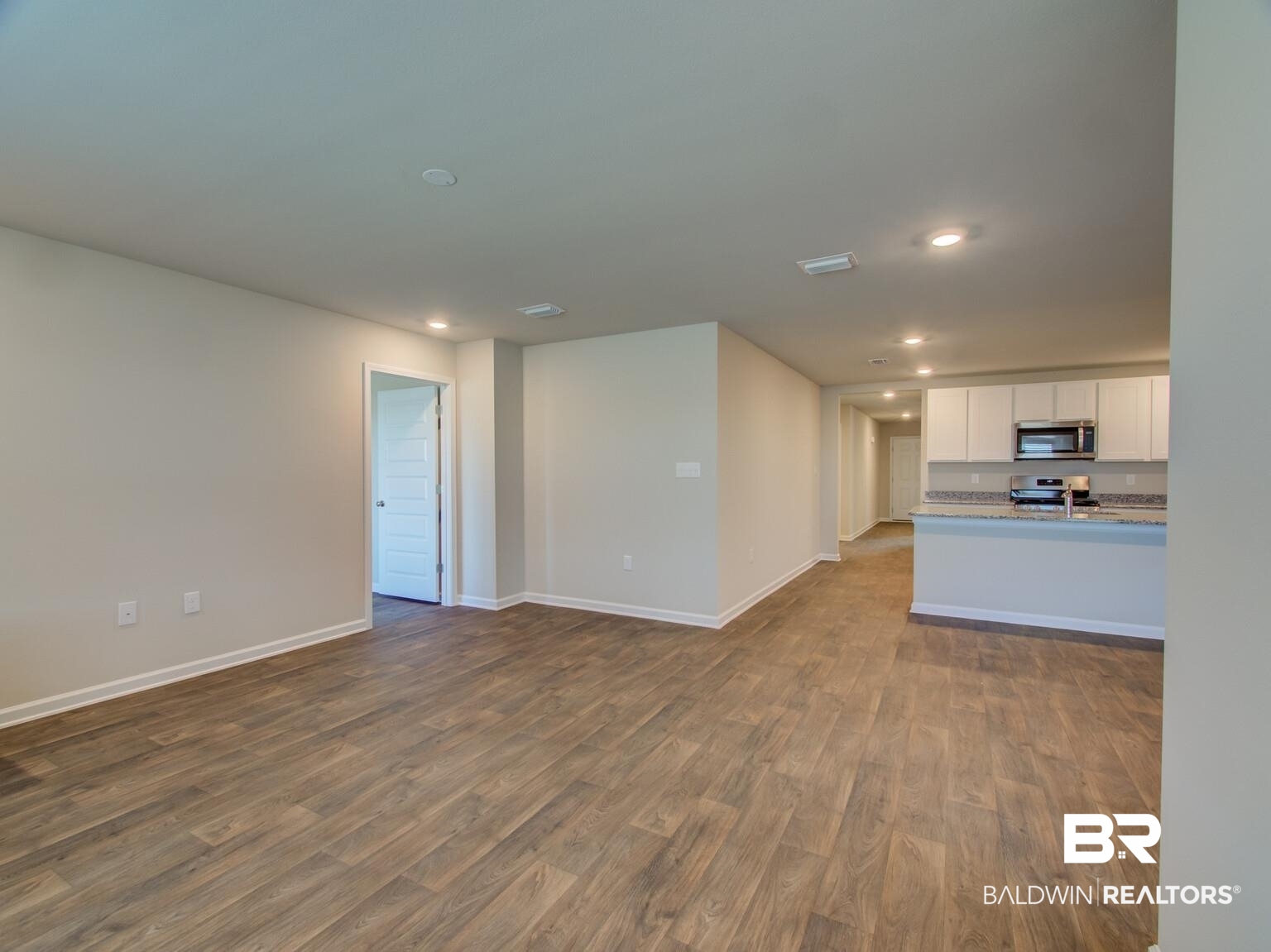 23952 Citation Loop Daphne, AL 36526 - Photo 20 of 69 Unfurnished living room with dark wood finished floors and recessed lighting