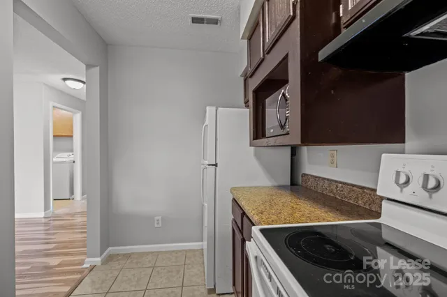 a white toilet sitting next to a shower