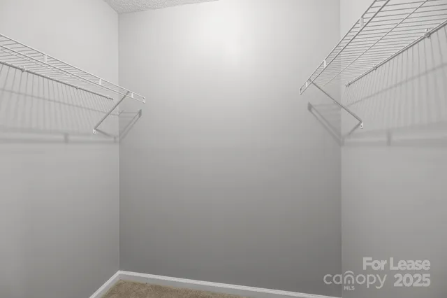 a bathroom with a bathtub shower sink mirror vanity and toilet