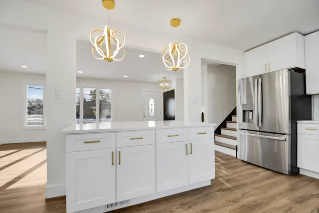 a kitchen with a refrigerator and countertop
