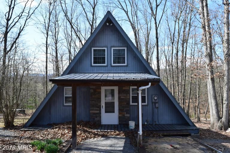 164 Holly Ridge Road Mount Jackson, VA 22842 - Photo 3 of 11 a front view of a house with a balcony