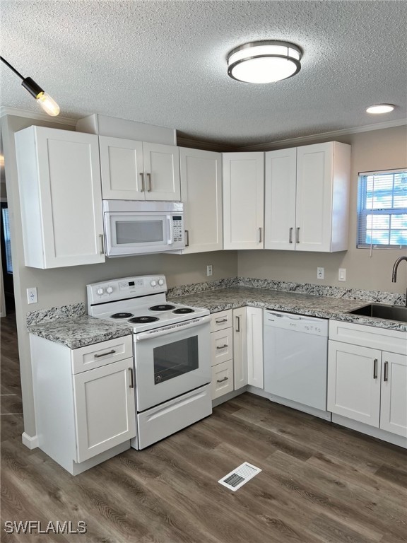 722 Higgins Road North Fort Myers, FL 33917 - Photo 5 of 14 a kitchen with granite countertop white cabinets and white appliances