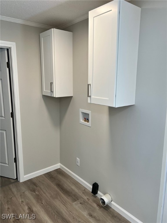 722 Higgins Road North Fort Myers, FL 33917 - Photo 8 of 14 an empty room with wooden floor and cabinets