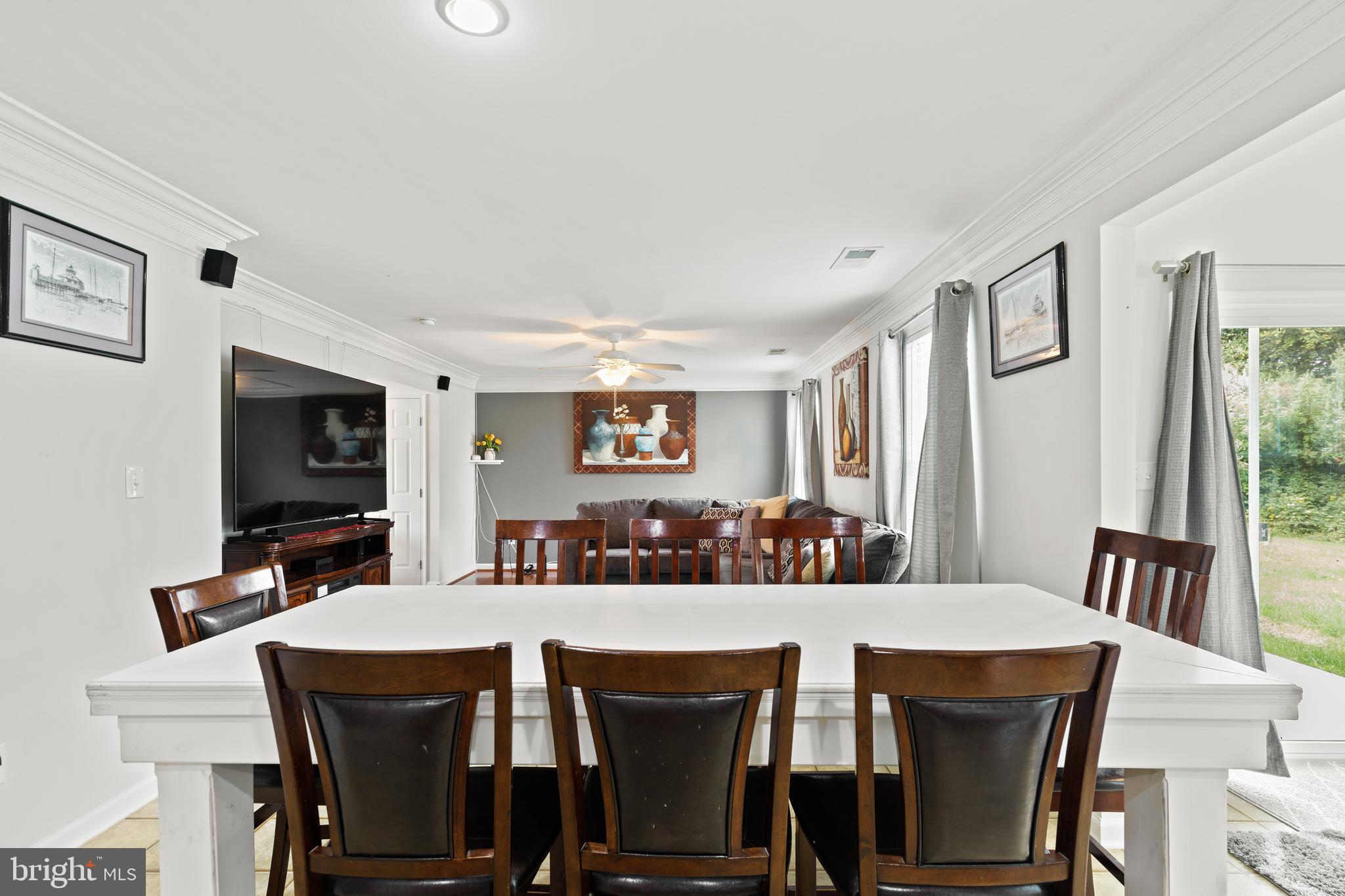 196 Bobbys Branch Road Millsboro, DE 19966 - Photo 11 of 37 a view of a dining room with furniture and wooden floor