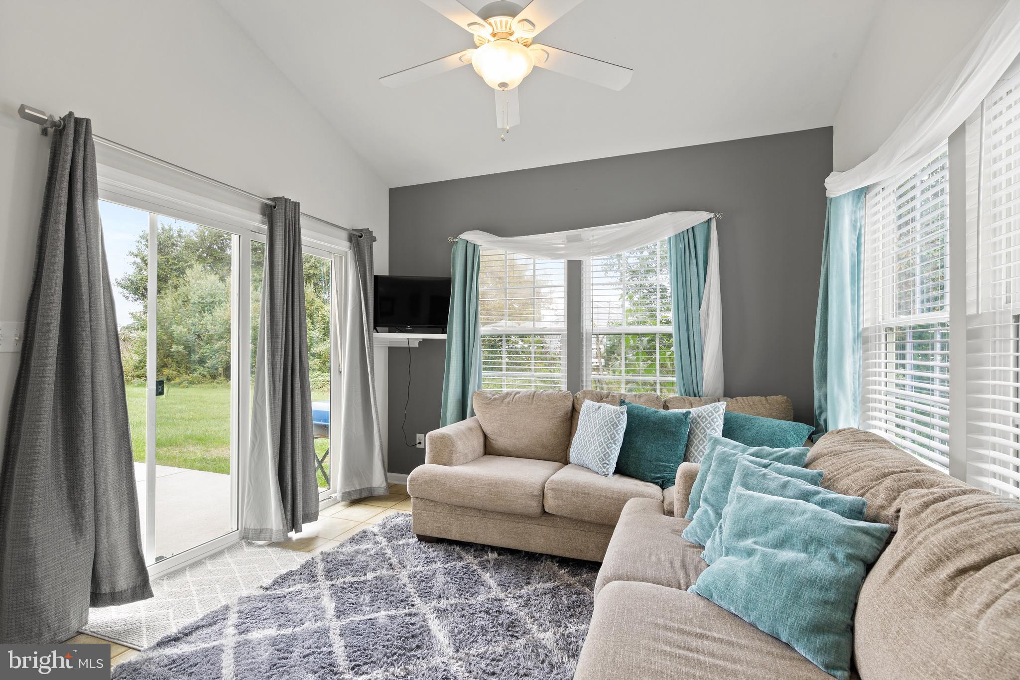 196 Bobbys Branch Road Millsboro, DE 19966 - Photo 17 of 37 a living room with furniture and a large window