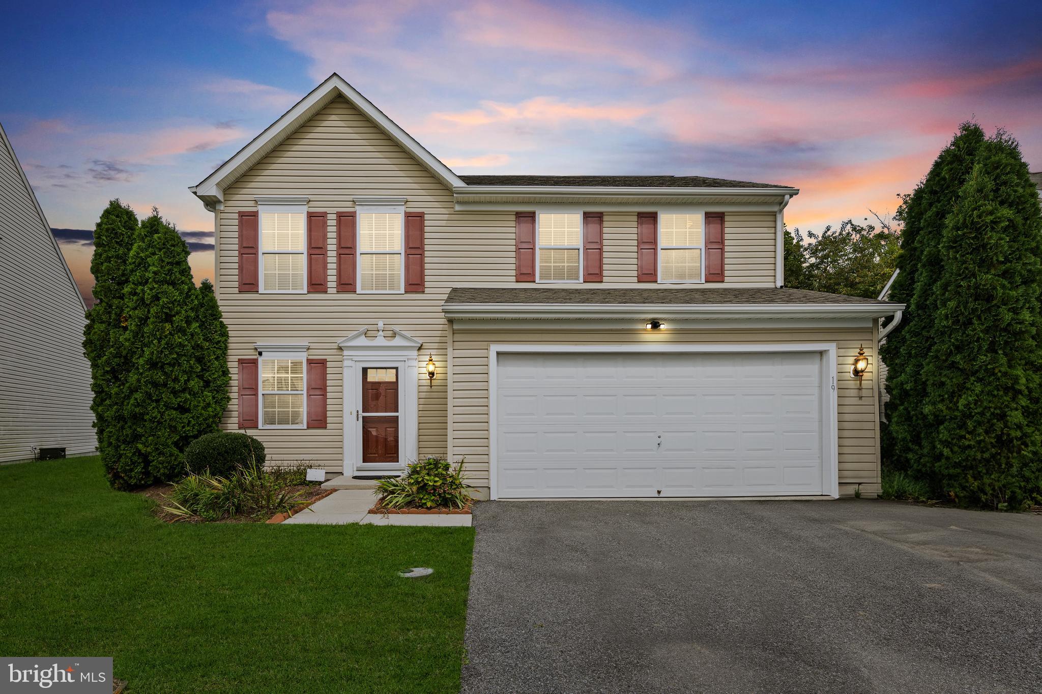 196 Bobbys Branch Road Millsboro, DE 19966 - Photo 2 of 37 a front view of a house with a yard and garage
