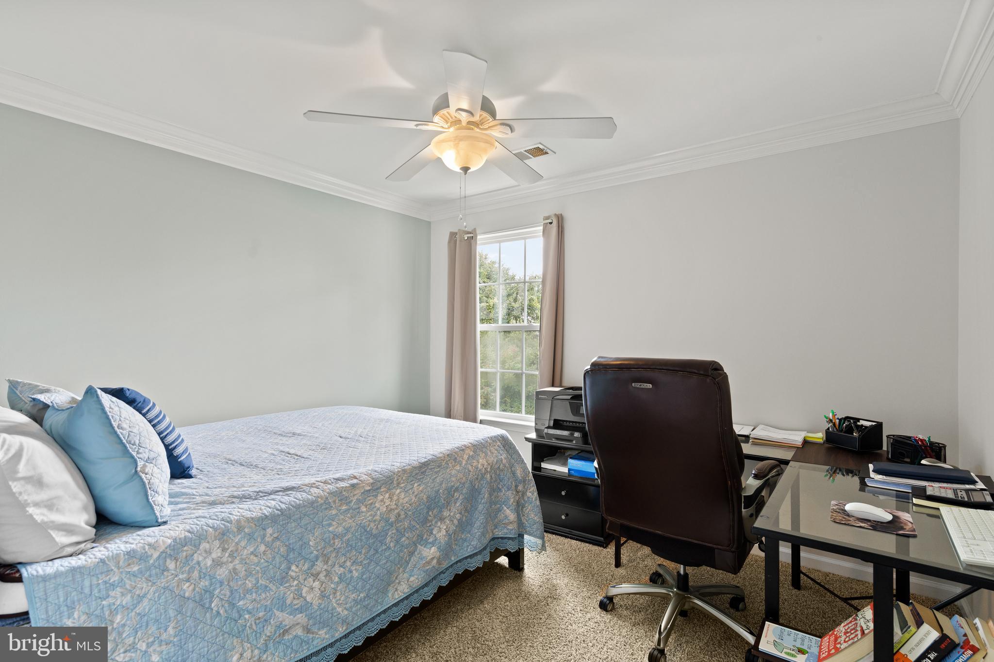 196 Bobbys Branch Road Millsboro, DE 19966 - Photo 21 of 37 a bedroom with a bed and a window