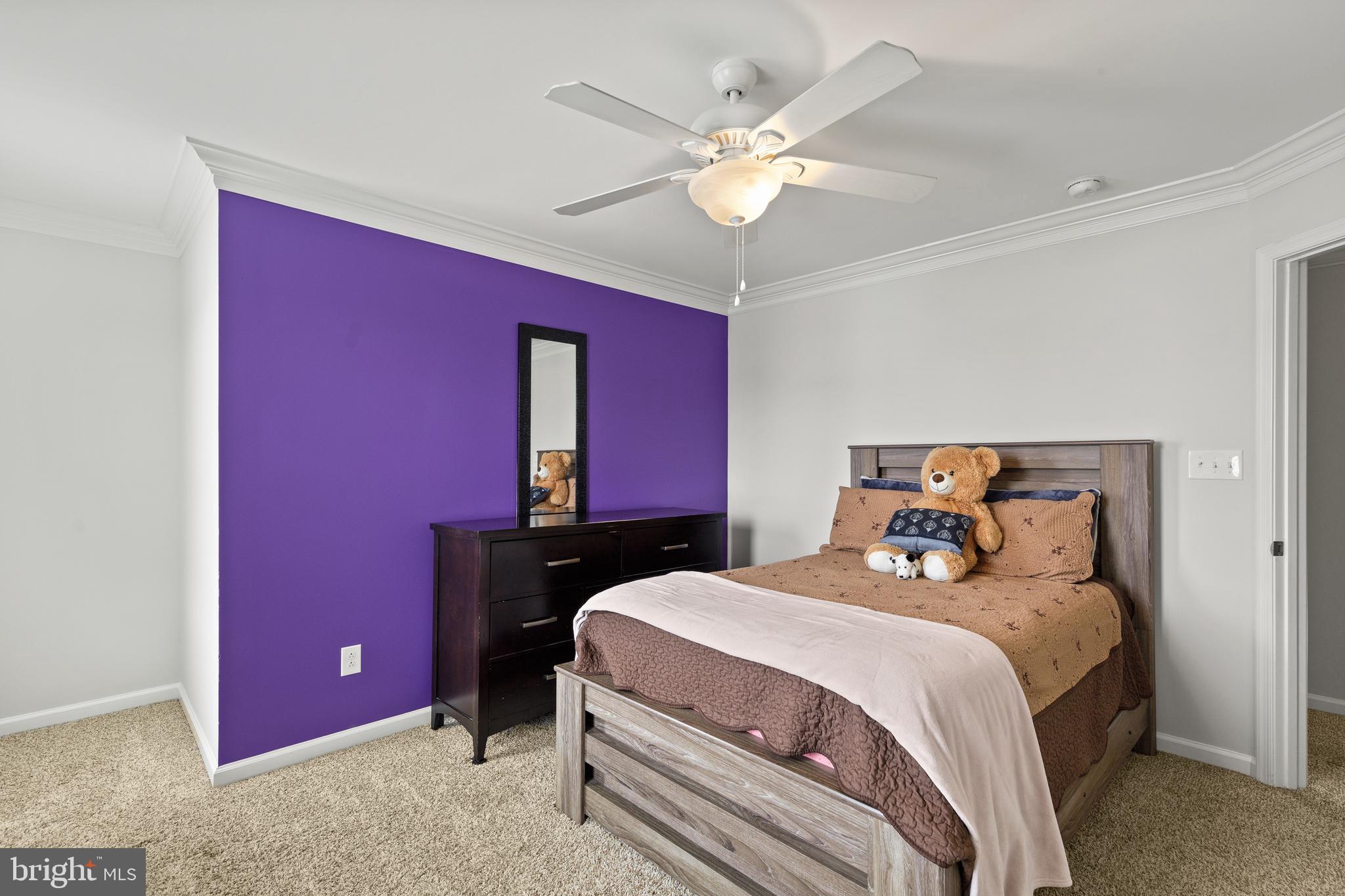 196 Bobbys Branch Road Millsboro, DE 19966 - Photo 25 of 37 a bedroom with a bed and a chandelier