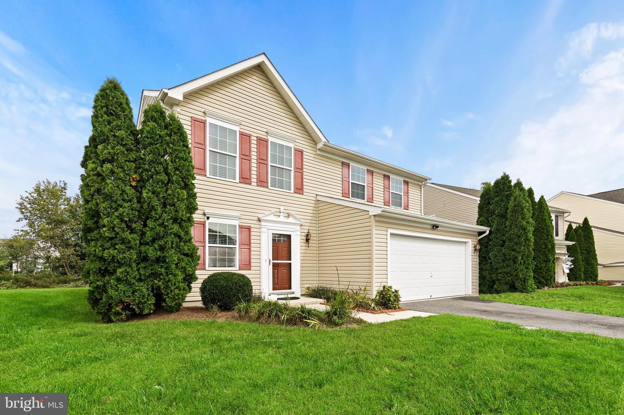 196 Bobbys Branch Road Millsboro, DE 19966 - Photo 3 of 37 a front view of a house with a yard and garage