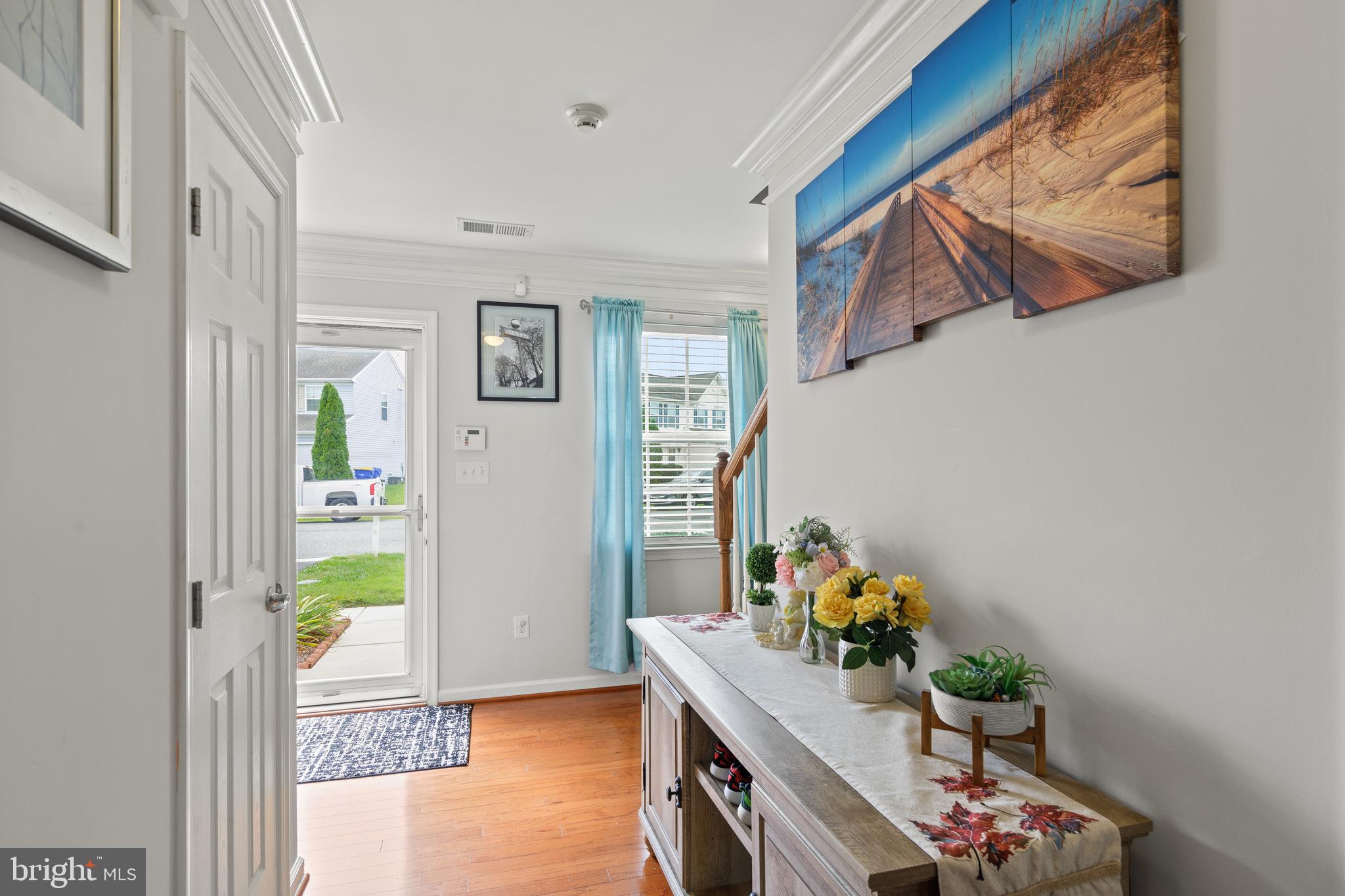 196 Bobbys Branch Road Millsboro, DE 19966 - Photo 4 of 37 a living room with furniture and flowers