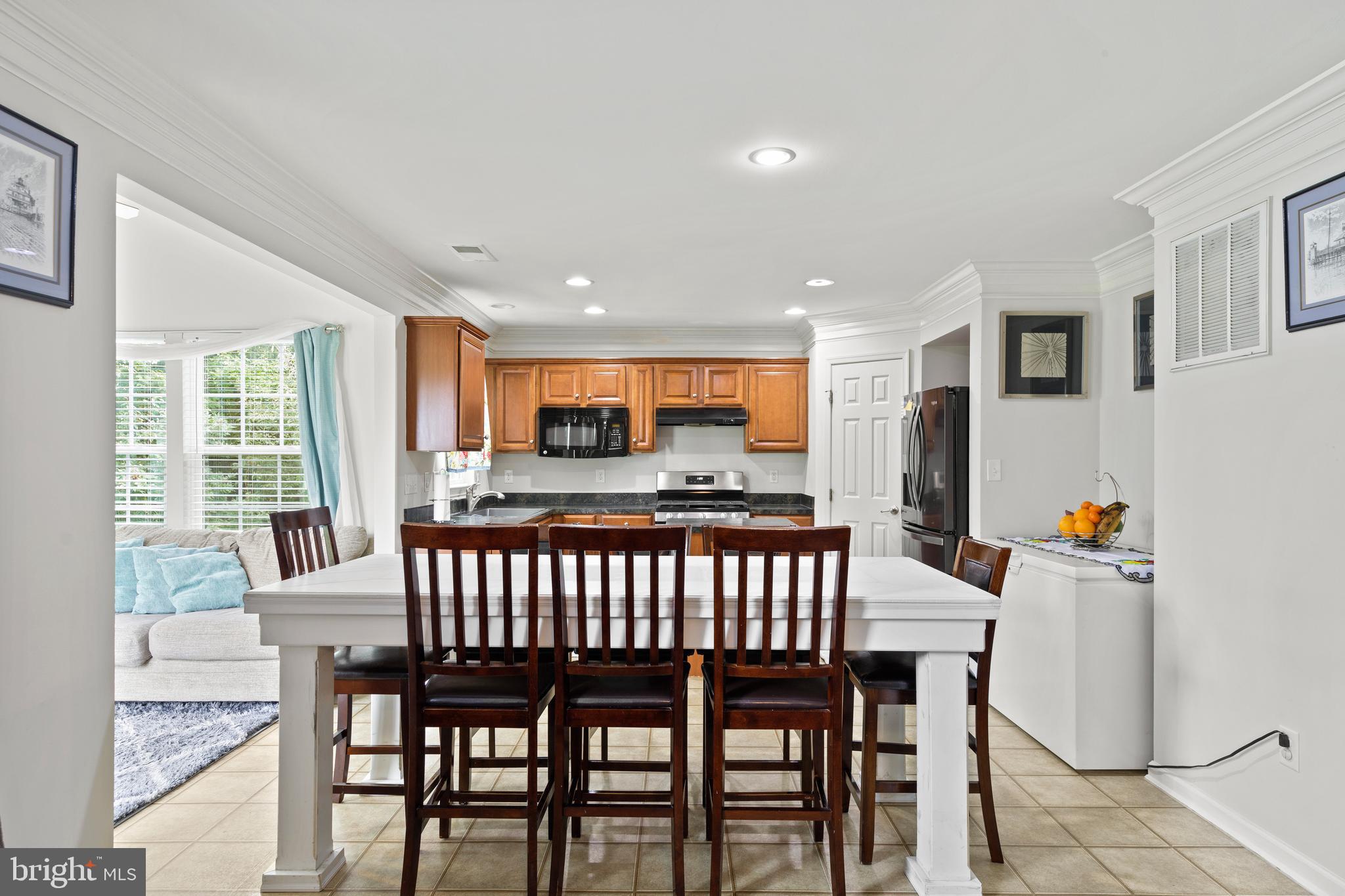 196 Bobbys Branch Road Millsboro, DE 19966 - Photo 9 of 37 a view of a dining room with furniture window and wooden floor