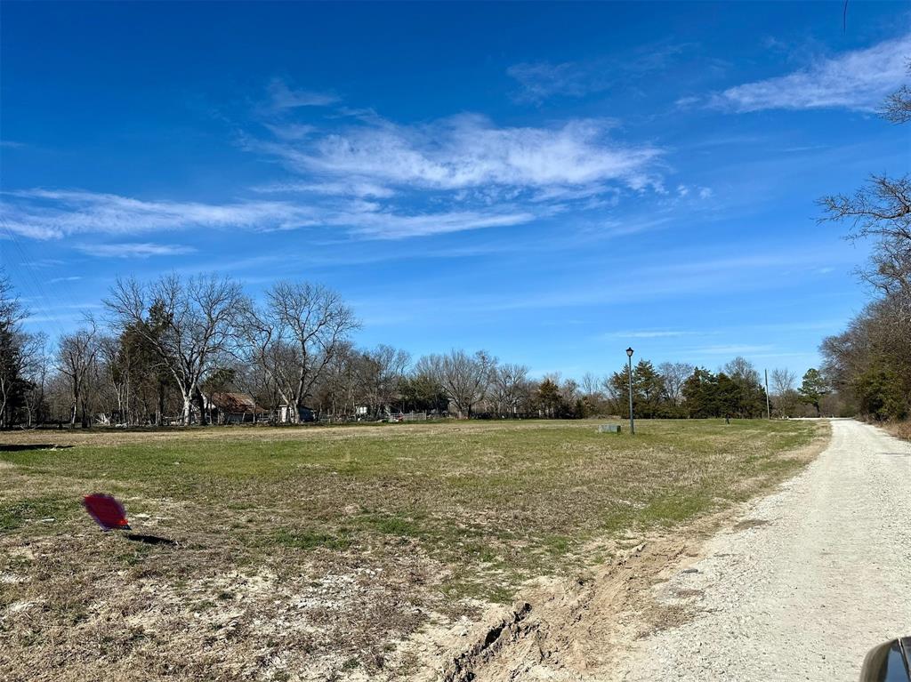 Lot 4 Rosemound Street Commerce, TX 75428 - Photo 2 of 5 a view of a field with an ocean