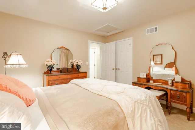 a bedroom with bed and a table