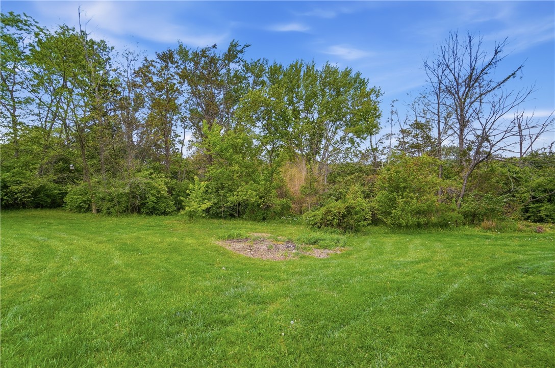 1208 Jarva Lane Springboro, OH 45066 - Photo 73 of 75 Lush green lawn provides a serene backdrop to this tranquil outdoor space.