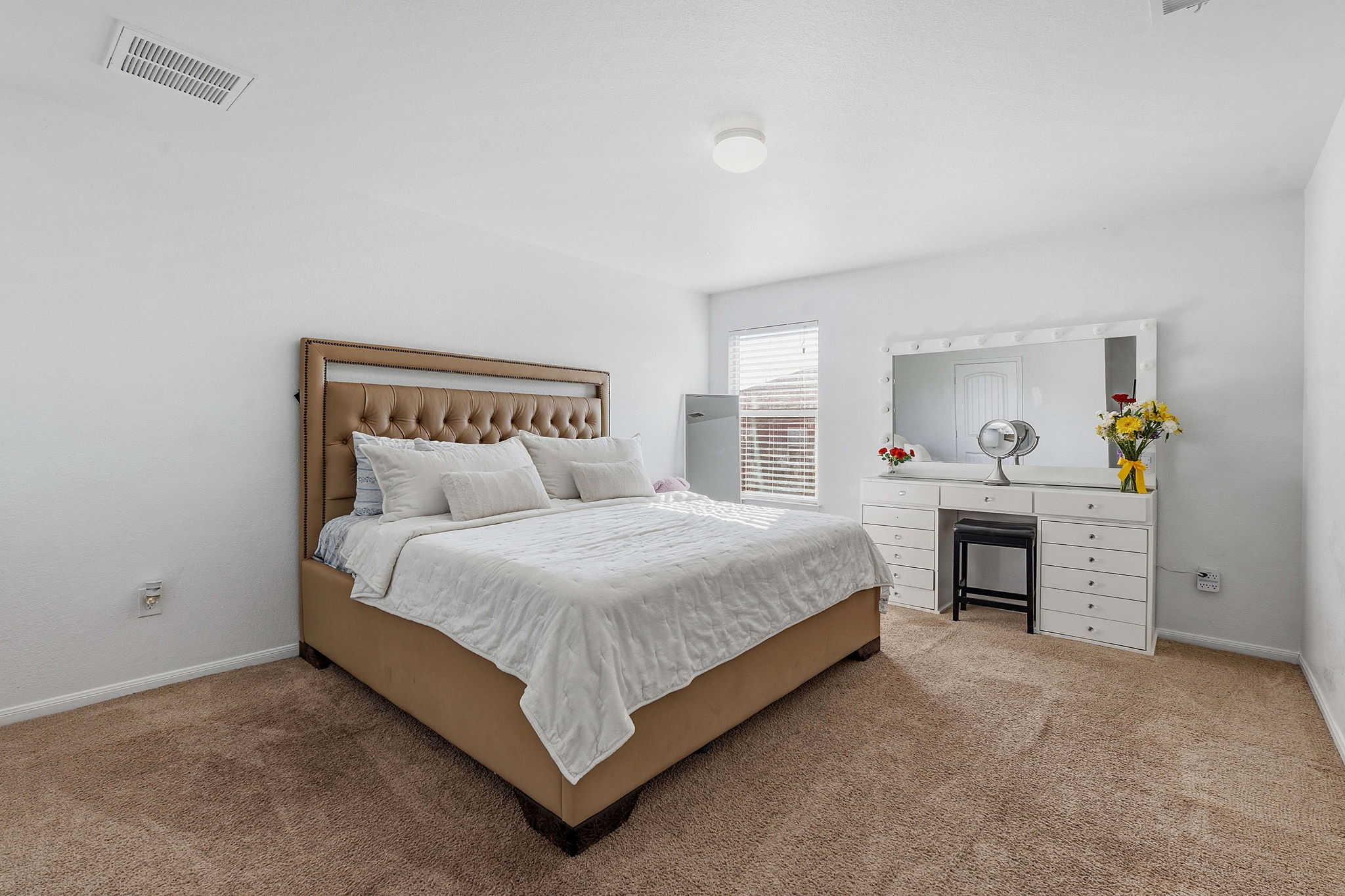 15101 Shell Bark Cove Austin, TX 78724 - Photo 12 of 26 Carpeted bedroom with neutral wall tones and a window featuring horizontal blinds